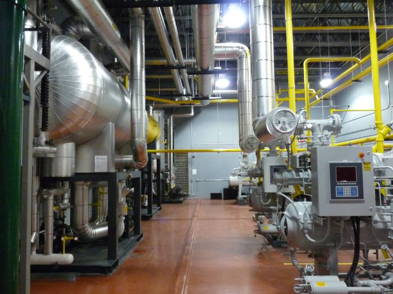 Multi-stage refrigeration Machine Room utilizing a natural refrigerant